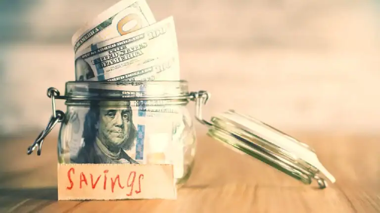 money in jar labeled savings representing retirement savings and long term investing