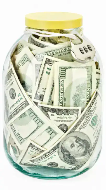 money in jar representing retirement savings and long term investing